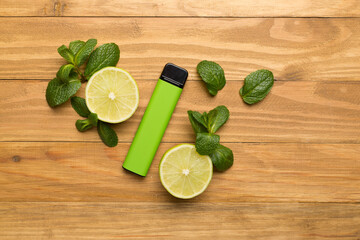 Disposable electronic cigarettes with fruits on wooden background, top view