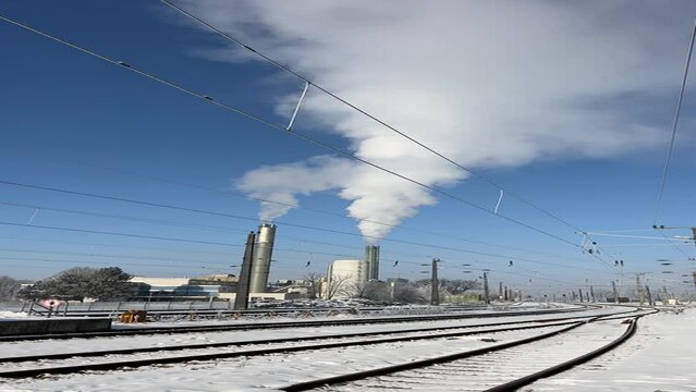district heating plant and railroad tracks in winter