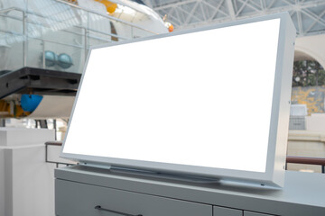 Horizontal blank digital interactive white display of electronic kiosk at exhibition or museum with futuristic scifi interior: close up. White screen, mock up, future, copyspace, technology concept