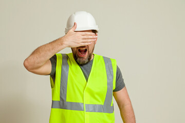 worker in a vest and white helmet