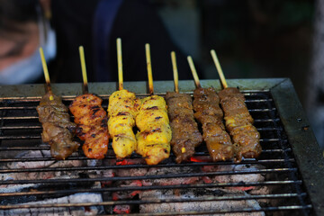 skewered meat dishes grilled over charcoal