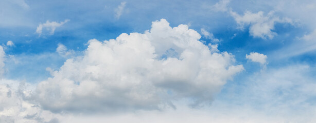 A big curly white cloud in the blue sky