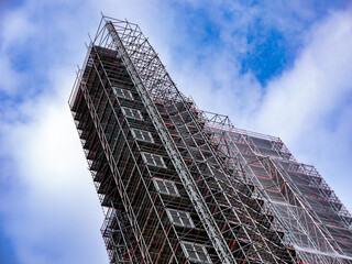 Building completely surrounded by scaffolding