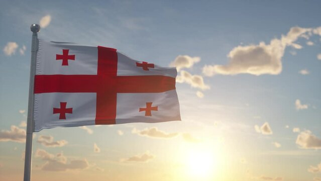 Flag of Georgia waving in the wind, sky and sun background