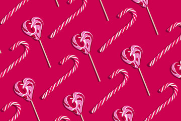 Christmas candies pattern on a magenta background. Flat lay, top view, copy space