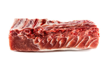A piece of raw beef or pork meat on a white background. Raw meat with ribs and bones