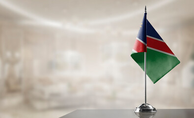 A small Namibia flag on an abstract blurry background