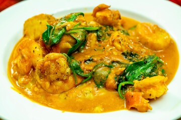 Shrimp and Grits (Polenta) and Scallops in a Tomato Cream Sauce