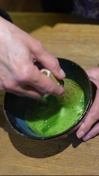 Making Japanese matcha latte, traditional matcha tool.