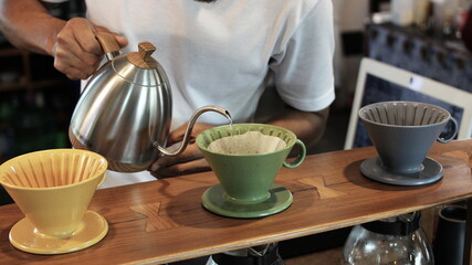 Barista making coffee at the shop