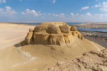 Faiyum desert oasis seen from the top of a rock formation.