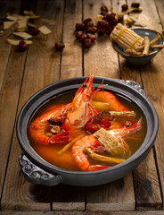 Live Prawn with Herbal Soup and Chinese Wine served in dish isolated on table top view of food