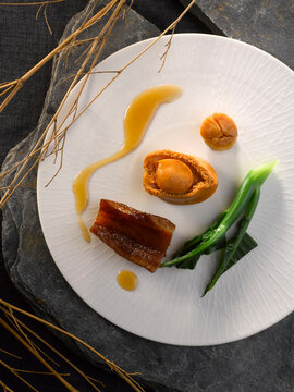 Braised Whole Abalone With Conpoy And Fish Maw In Brown Sauce Served In Dish Isolated On Table Top View Of Food