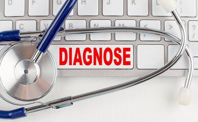 DIAGNOSE text on keyboard with stethoscope , medical concept