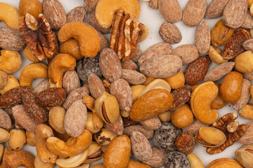 A group of almonds, pistachios, walnuts, macadamia, cashews.