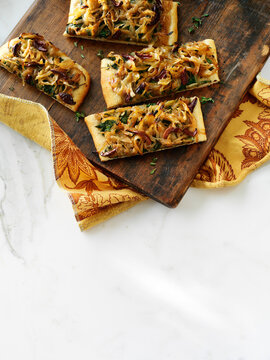 Overhead View of Pissaladiere with Carmelized Onions, Black Olives and Spinach, Studio Shot