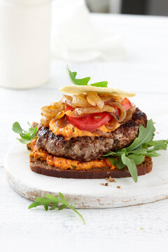 Turkey Burger with Caramelized Onions and Hummus on Rye Bread, Studio Shot