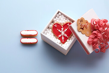 Overhead View of Sugar Cookie Equal Sign next to Heart Shaped Sugar Cookie in Gift Box, Studio Shot