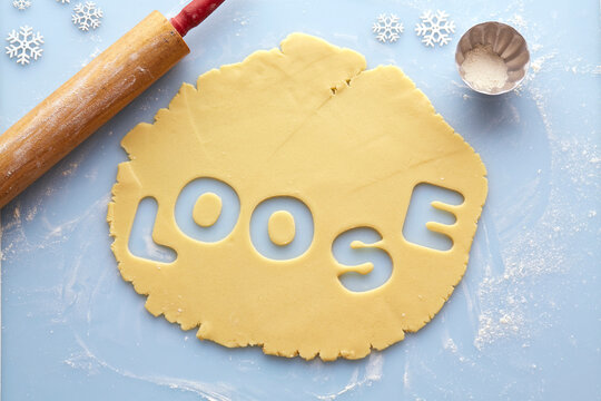 Overhead View of Rolled out Suger Cookie Dough with LOOSE cut out of it, Studio Shot