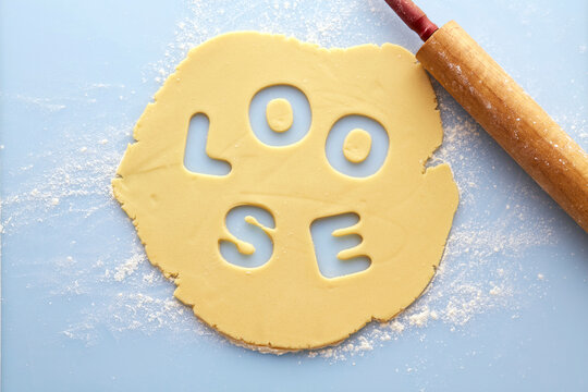 Overhead View of Rolled out Suger Cookie Dough with LOOSE cut out of it, Studio Shot