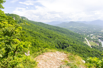 Summer, mountainous terrain, hiking trails running through the park, a place for hiking and...