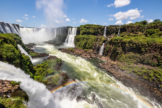 Lush foliage surrounding the waterfalls of Iguazu Falls; Foz do Iguacu, Parana, Brazil