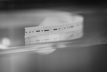 Paper ticker tape with Morse code..