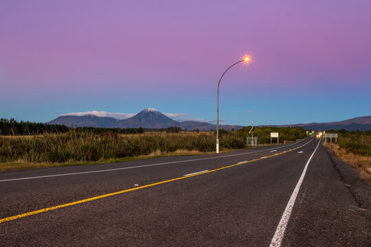 A beautiful sunset in the Tongariro National Park. The volcanic Mount Doom or Mount Ngauruhoe can be seen in the background; Manawatu-Wanganui, New Zealand