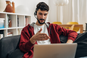 Man is speaking in an online meeting using headset