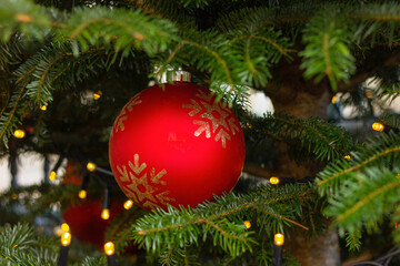 red ornate on a Christmas tree. New Year festive decor