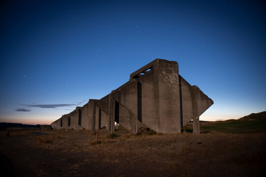 Remaining ruins of the old cement plant at Chambers Bay Golf Course at dusk, Washington, USA