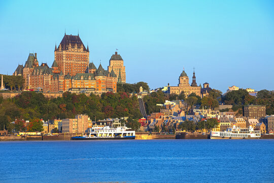 Chateau Frontenac and a vehicle ferry on the Saint Lawrence River; Quebec City, Quebec, Canada
