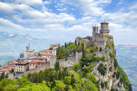 Guaita Tower on the peak of Mount Titan with a cloud filled sky on a sunny day;  Republic of San Marino, North-Central Italy