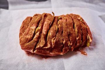 Meat in seasoning ready for baking in the oven. Cooking homemade meat