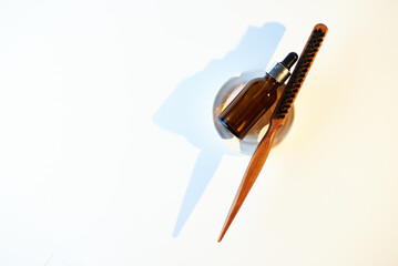 Man beard oil with wooden beard comb