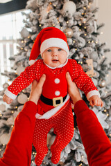 Baby on the background of a Christmas tree