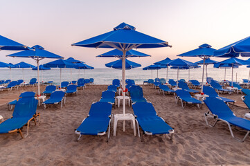 beach chairs and umbrellas on beach