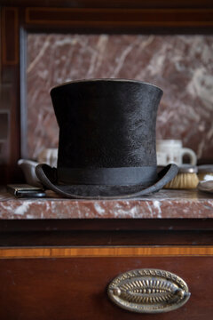 Close-up of a top hat resting on a marble tabletop in one of the bedrooms in Strokestown Park museum; Strokestown, County Roscommon, Ireland