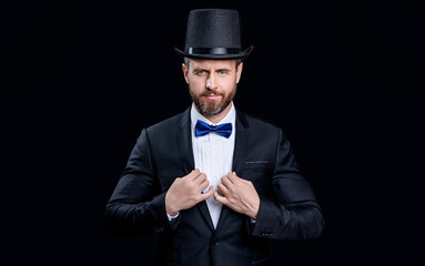 caucasian tuxedo showman in studio. tuxedo showman with cylinder hat. photo of tuxedo showman