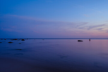 Sunset over the Baltic Sea on the beach of Ostersomarken, Bornholm Island, Denmark, Scandinavia, Europe.