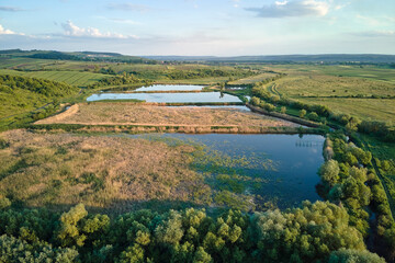 Fototapeta na wymiar Aerial view of fish hetching pond with blue water in aquacultural area