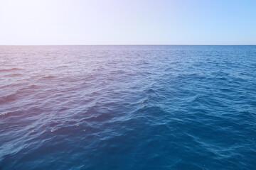 The front view in the morning sky is bright blue with clear white clouds. And the ocean deep indigo...