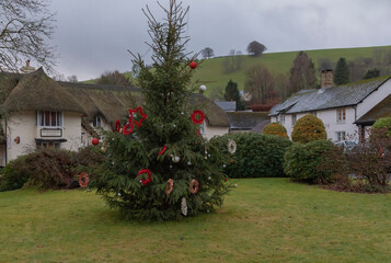 Christmas tree on a hamlet village green decorated