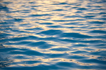 Closeup seascape surface of blue sea water with small ripple waves