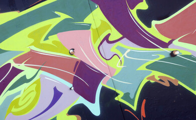 Colorful background of graffiti painting artwork with bright aerosol strips on metal wall. Old...