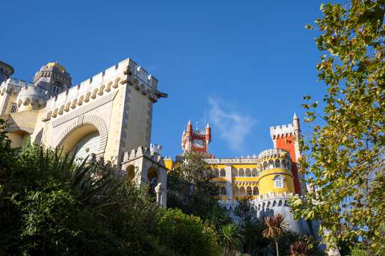 The hilltop castle of Palacio Da Pena with its colorful rooftop turrets situated in the Sintra Mountains; Sintra, Lisbon District, Portugal