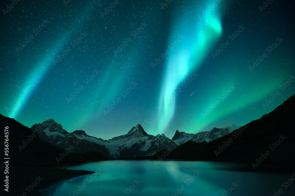 Wall mural aurora borealis. northern lights in winter mountains. sky with polar lights and stars. stars reflect
