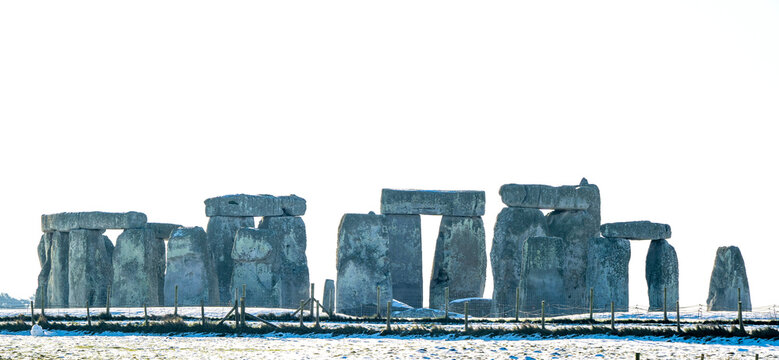 Stonehenge defined by early morning snow; Wiltshire, England, United Kingdom