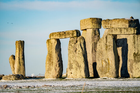 Stonehenge defined by early morning snow; Wiltshire, England