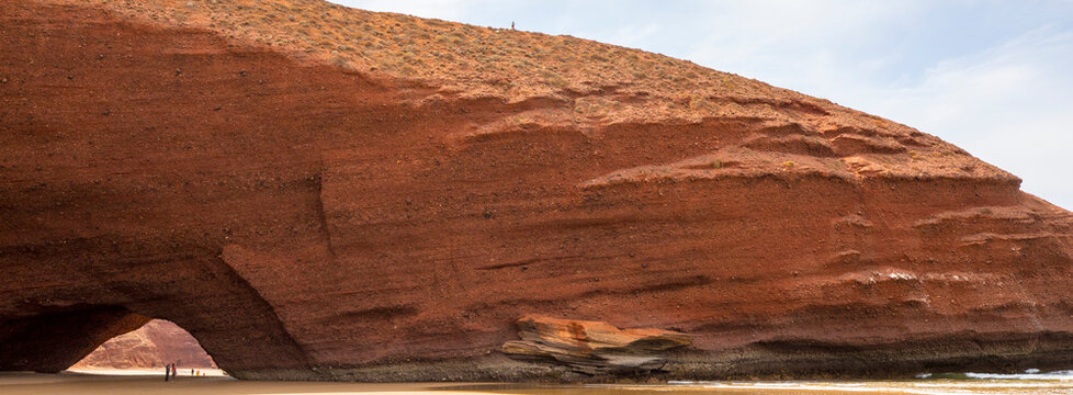 Sea carved arch in sedimentary rock on Legzira Beach on the Atlantic Ocean near Sidi Ifni; Tiznit Province, Souss-Massa (Souss-Massa-Dra&acirc;), Morocco